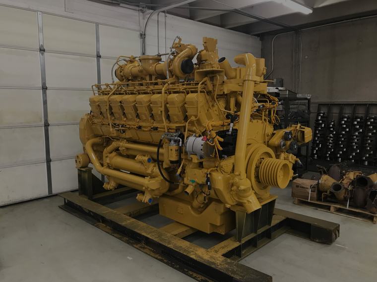 Large diesel generator engine on its skid awaiting overhaul