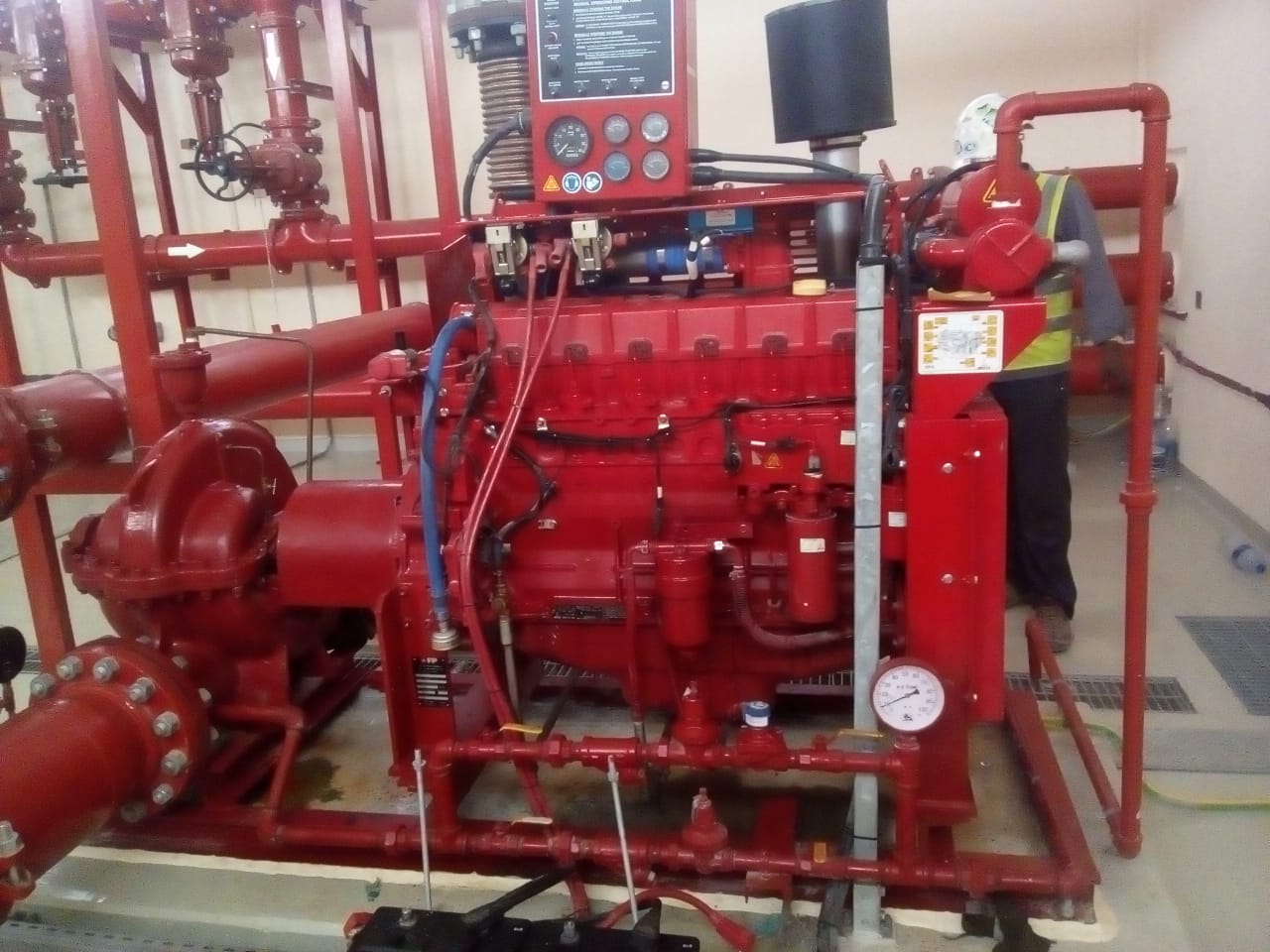Diesel fire-pump package with a technician alongside