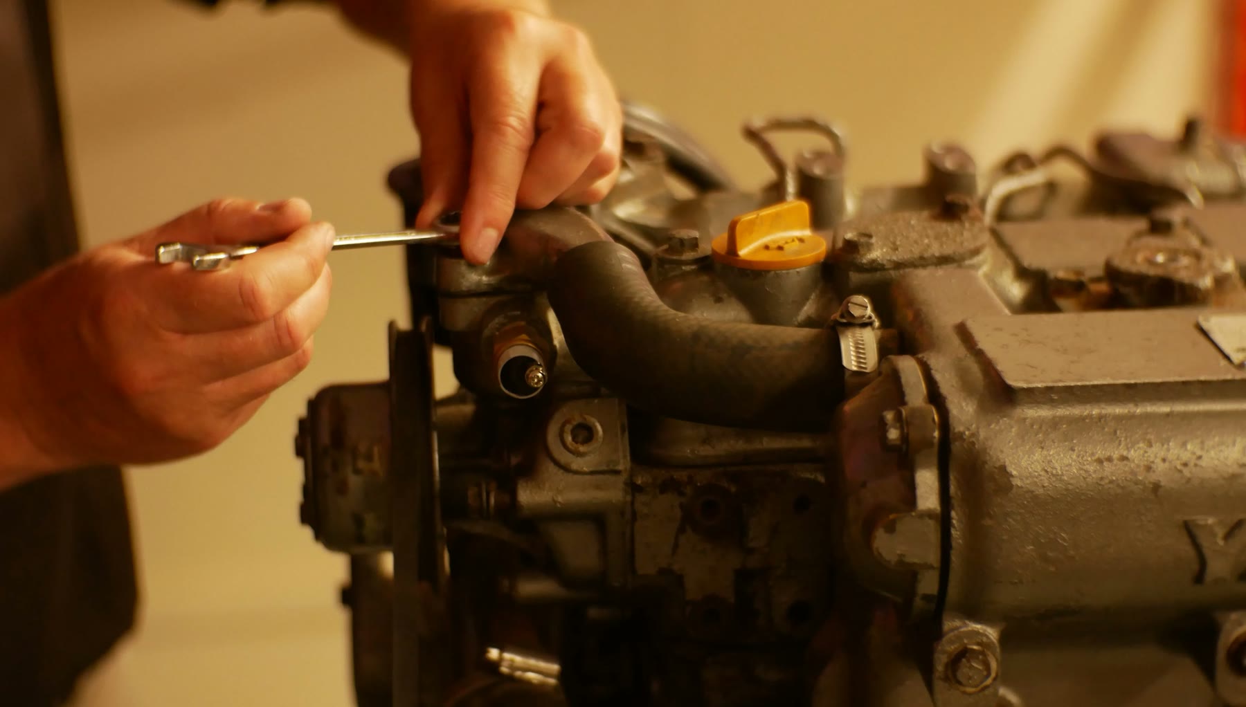 Technician carrying out bench work on a diesel injection pump