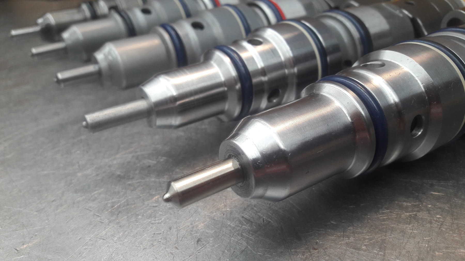 A set of reconditioned diesel injectors in the workshop