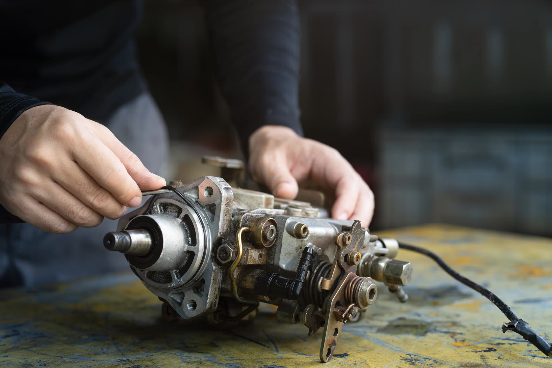 Rotary distributor injection pump being worked on at the bench