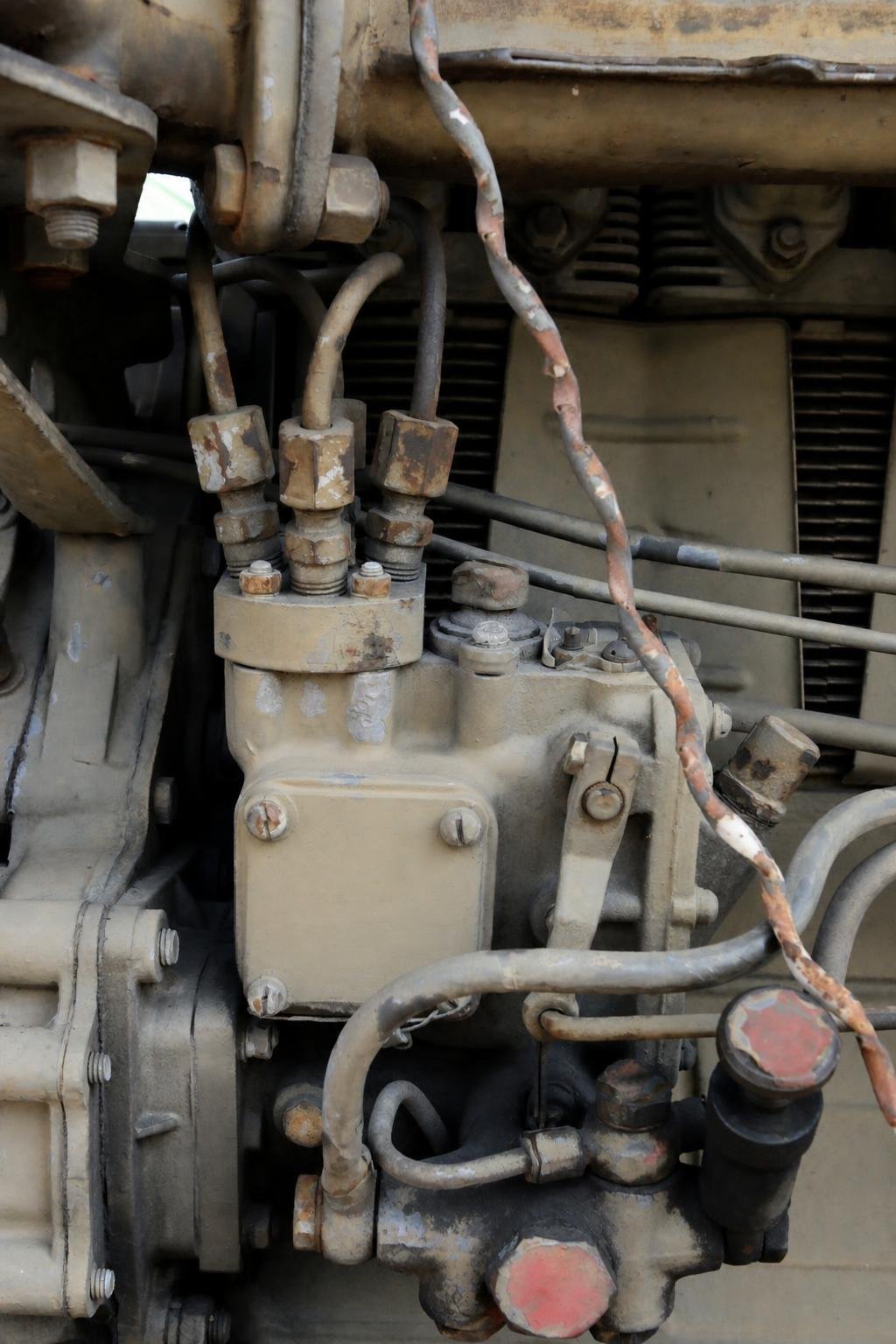Large, sharp portrait of a distributor injection pump for a four-cylinder diesel engine.