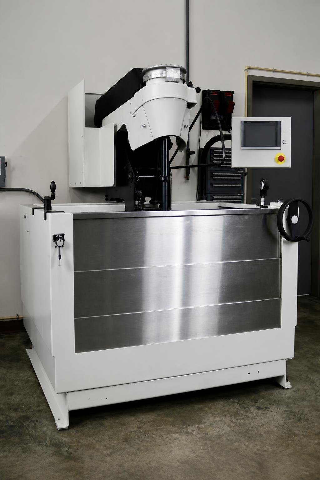 Large Sunnen SV-15 vertical honing machine inside a clean engine machine shop.