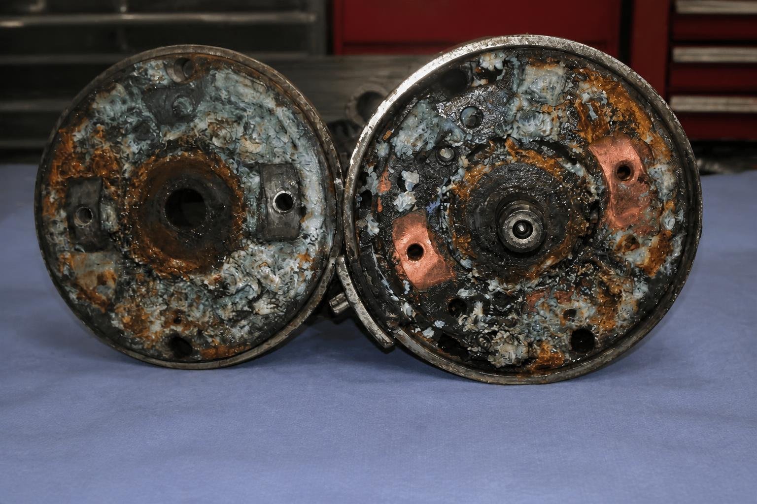Opened starter-motor components with severe water contamination and corrosion